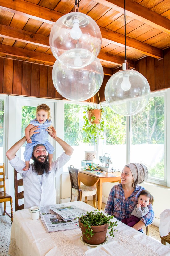 family portrait photography of zak stern and batsheva wulfsohn with daughters at dining table