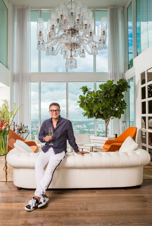 portrait photography of naeem khan in his living room