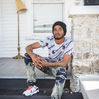 portrait photography of Hakeem Drane, sitting outside on steps